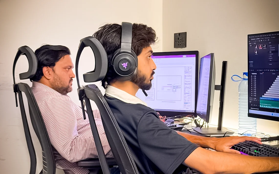 Professionals working at computers in Plugin coworking space