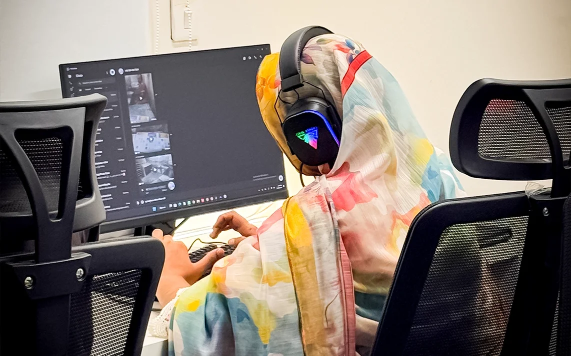 Woman working at a desk in Plugin